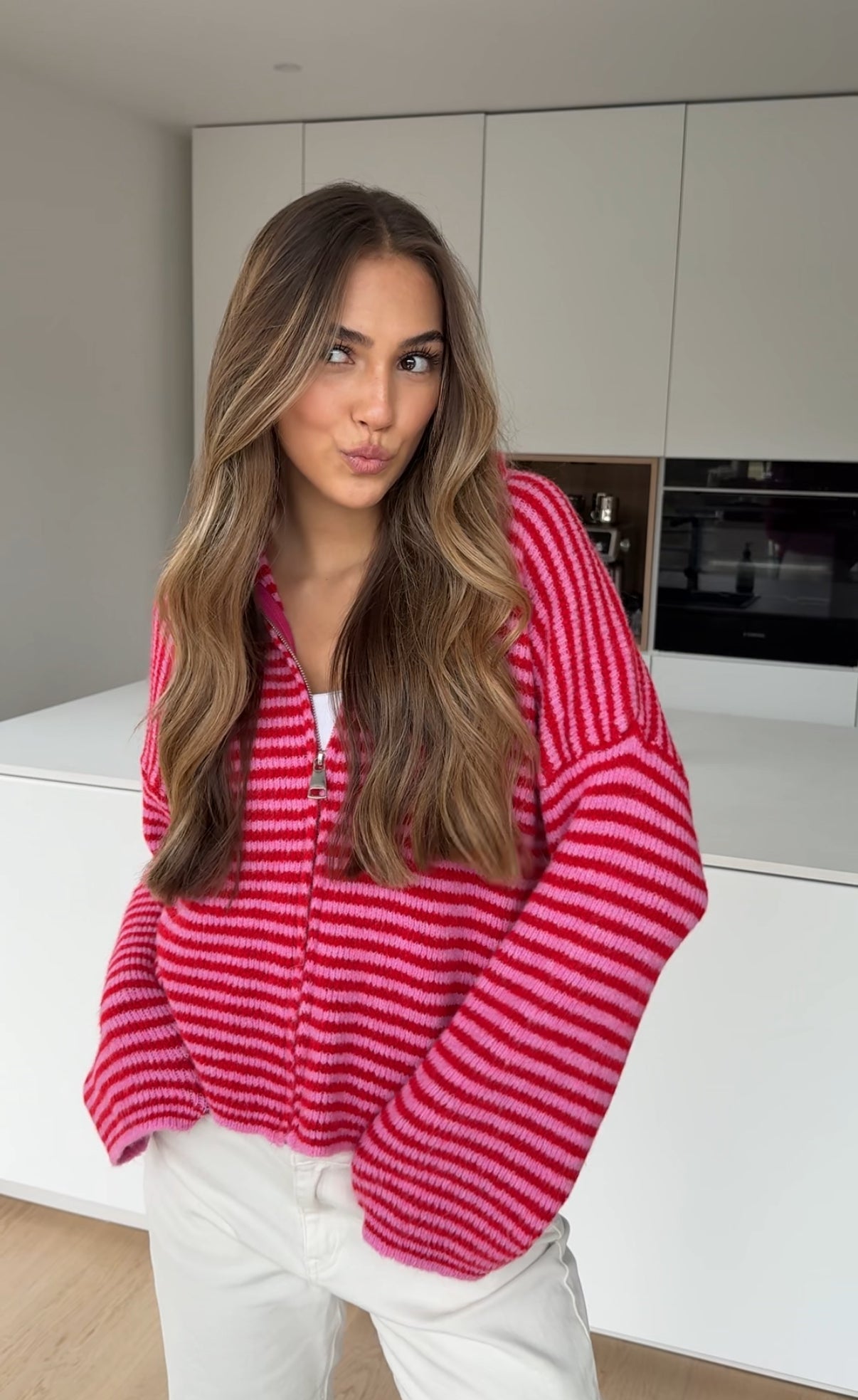 CÁRDIGAN DE PUNTO CON CREMALLERA A RAYAS